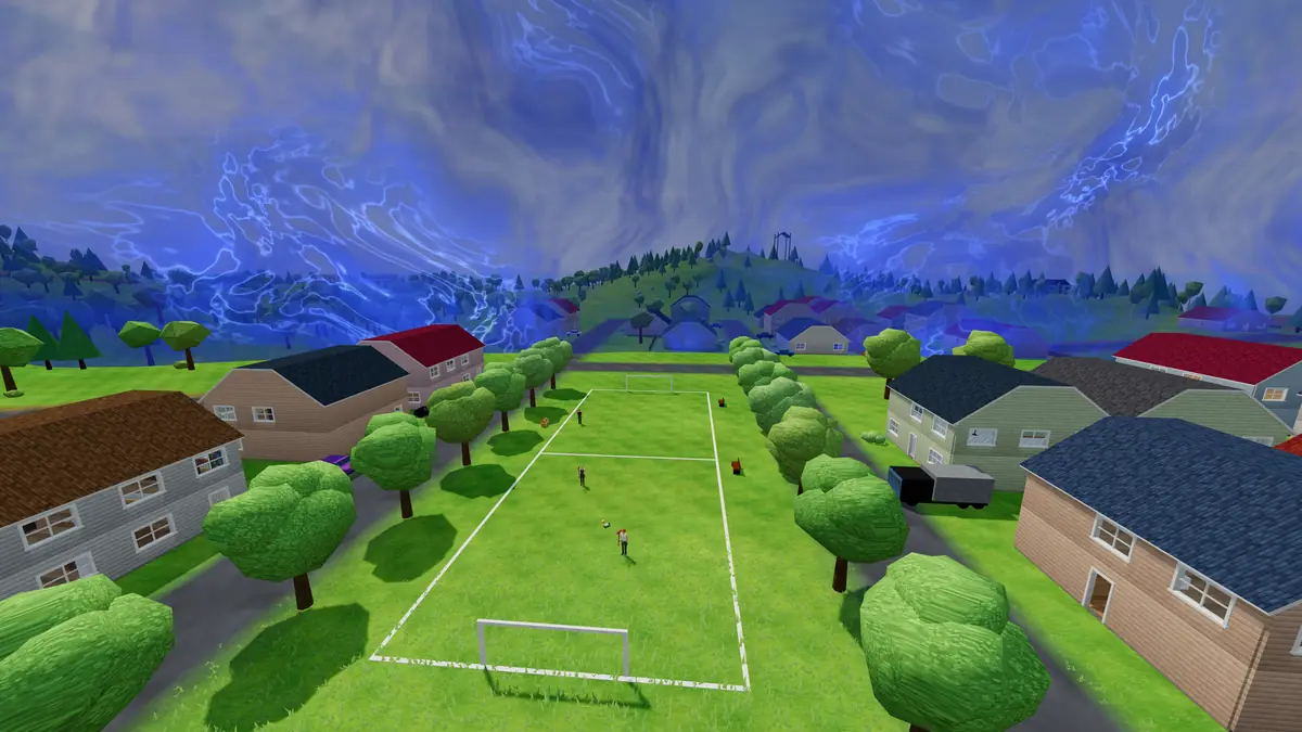 The dark blue storm wall rolls over the houses of Maple Meadows beyond a sports field.